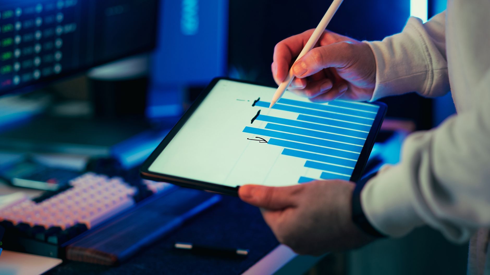A digital workspace dashboard on a tablet being annotated with a stylus.